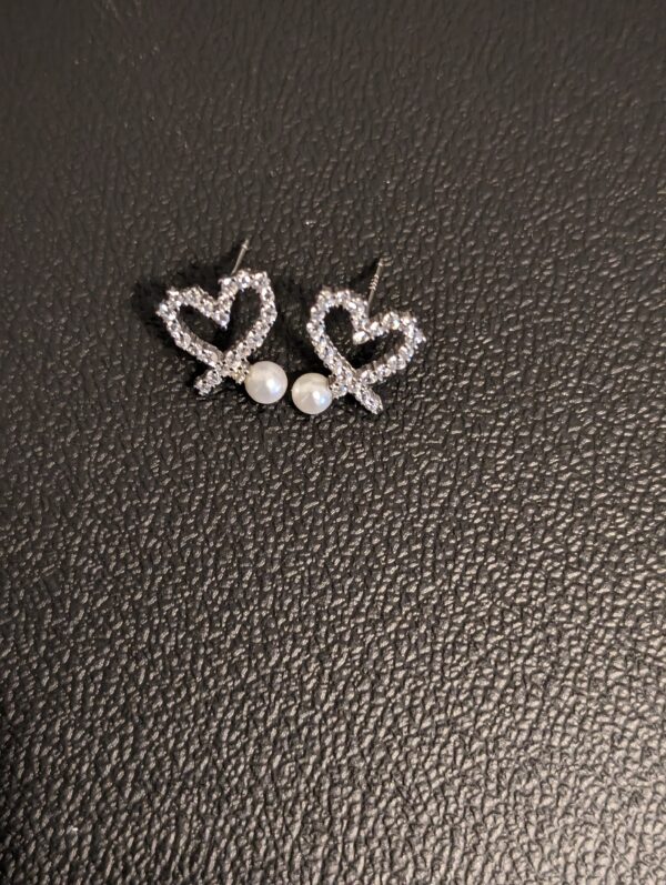 Woman’s Heart Shaped Sterling Silver Earrings